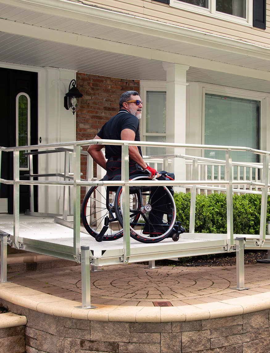 Man on wheelchair ramp